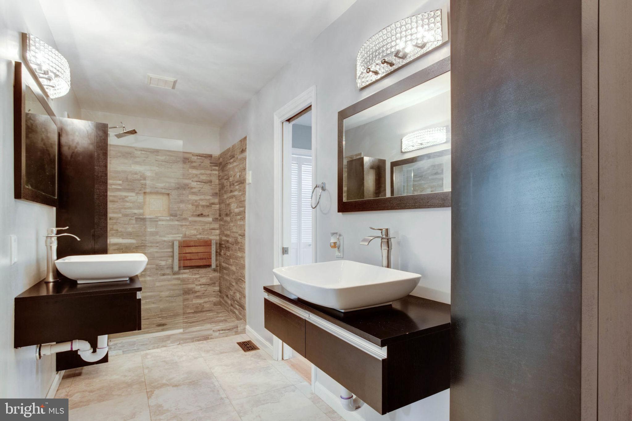 4304 Rousbys Run West River, MD 20778 - Photo 19 of 50 a bathroom with a sink and a mirror