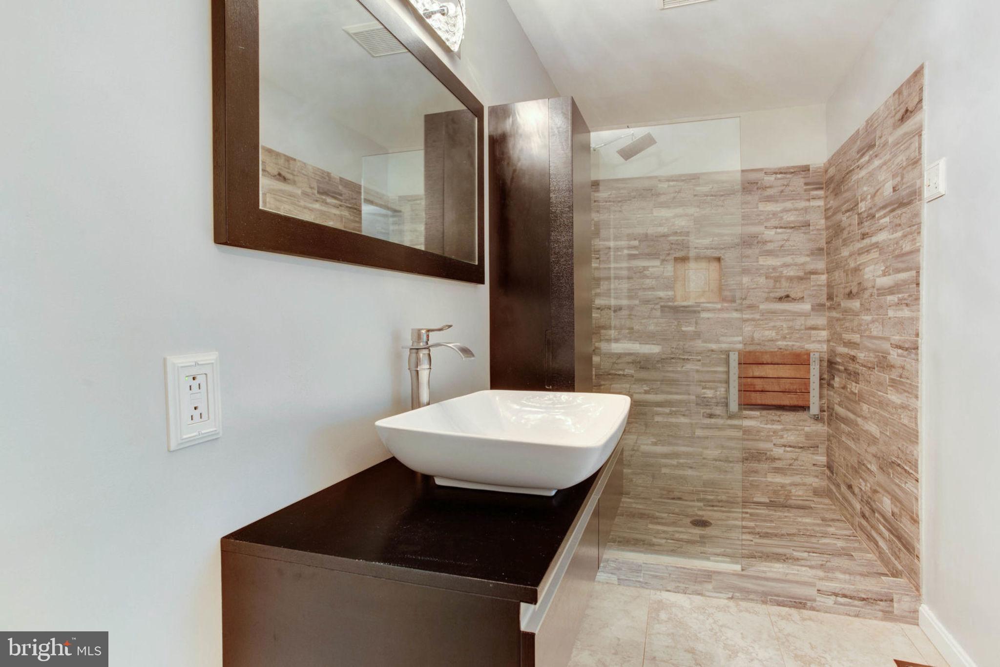 4304 Rousbys Run West River, MD 20778 - Photo 20 of 50 a bathroom with a sink and a mirror