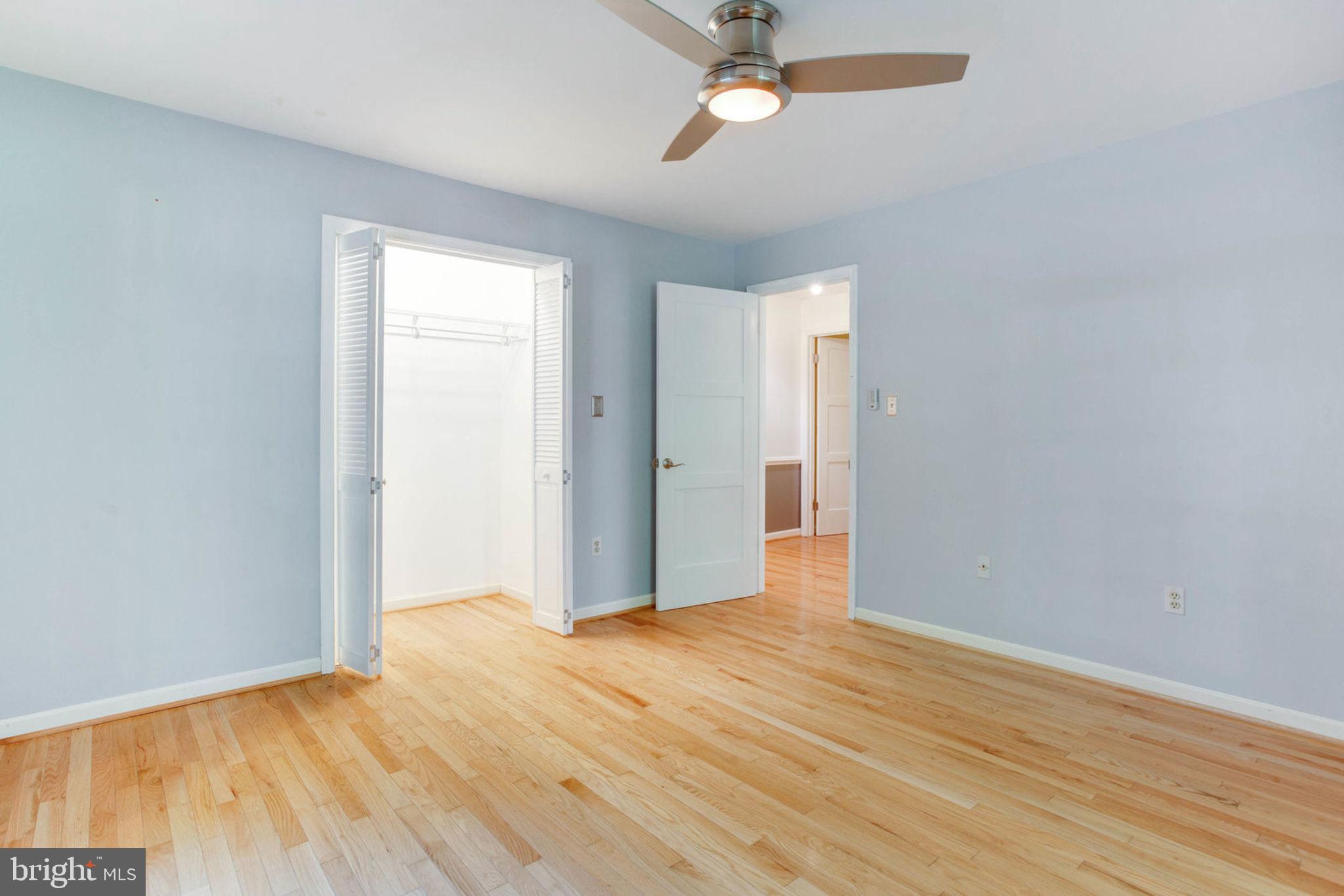 4304 Rousbys Run West River, MD 20778 - Photo 22 of 50 a view of empty room with wooden floor