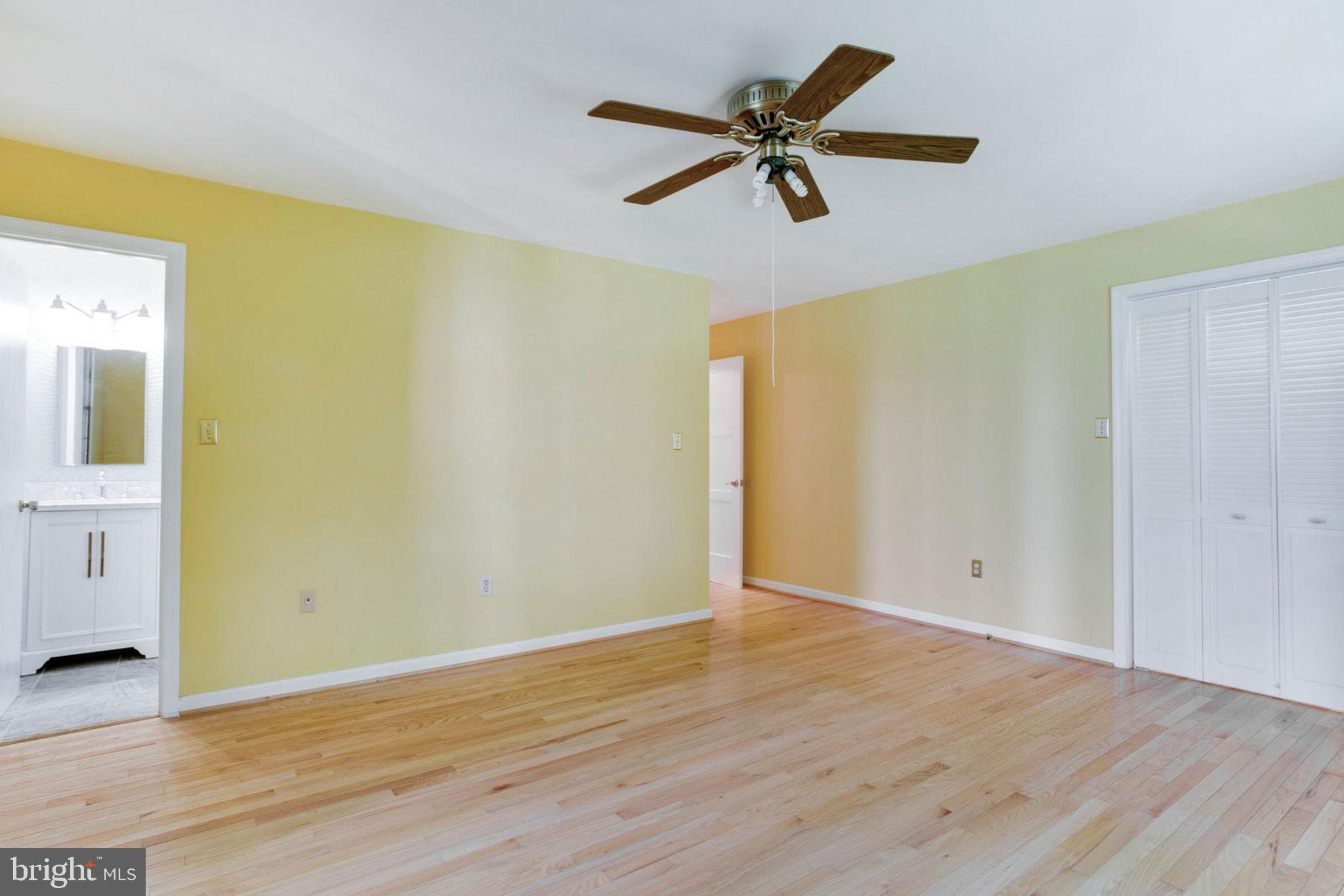 4304 Rousbys Run West River, MD 20778 - Photo 23 of 50 a view of room with wooden floor and ceiling fan