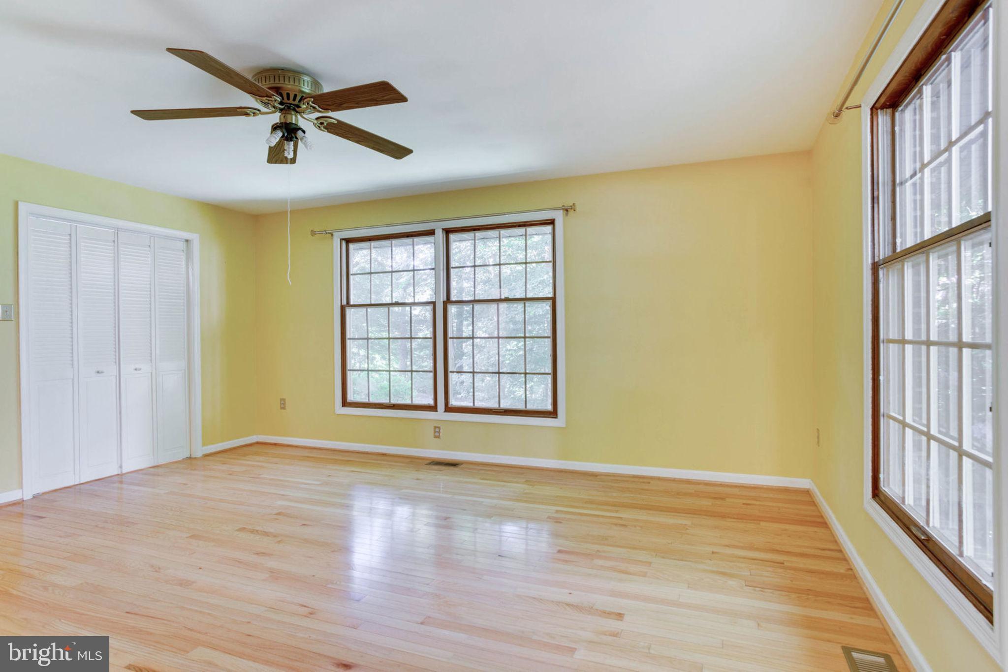 4304 Rousbys Run West River, MD 20778 - Photo 24 of 50 a view of an empty room with a window and wooden floor