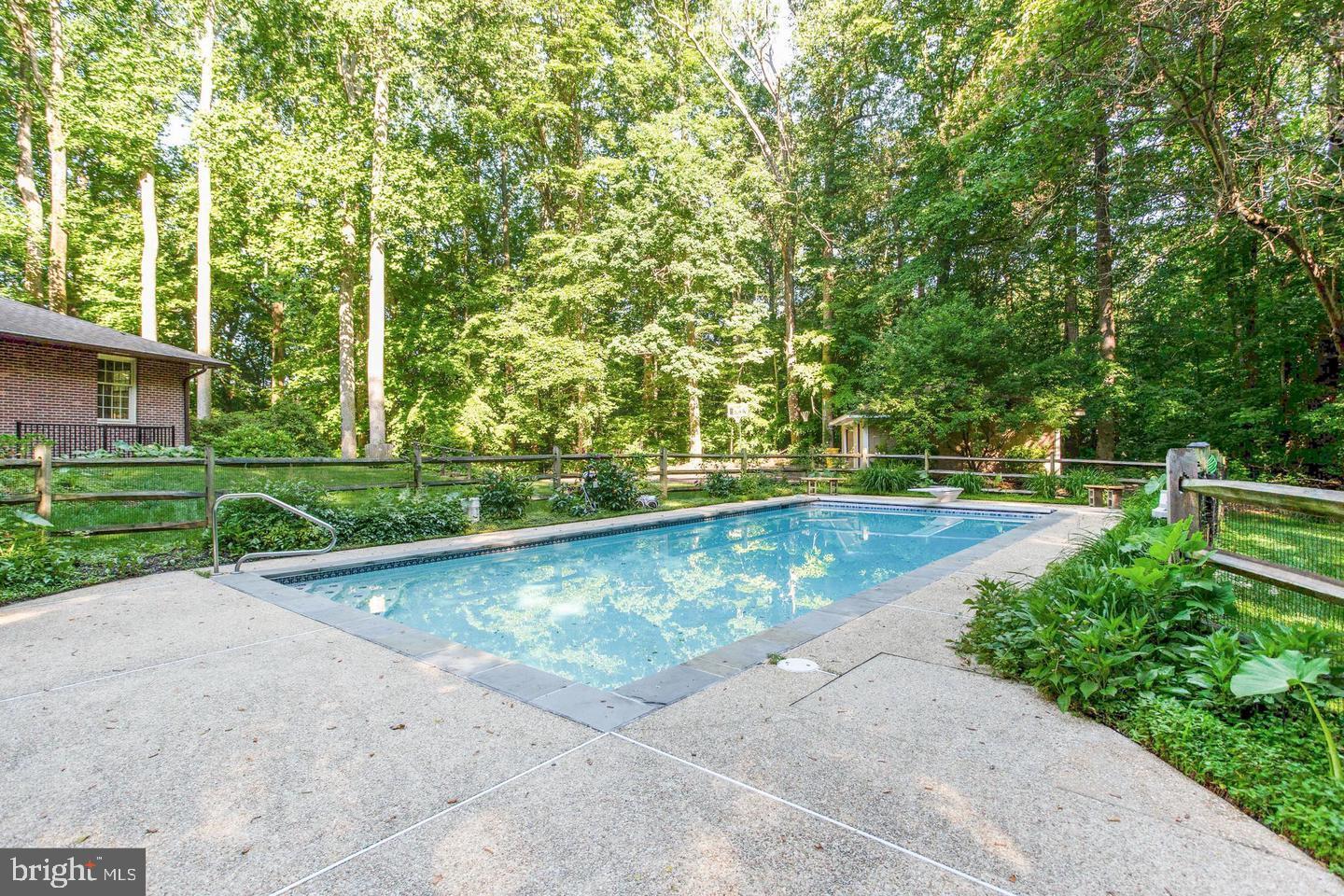 4304 Rousbys Run West River, MD 20778 - Photo 42 of 50 a view of a swimming pool with a yard