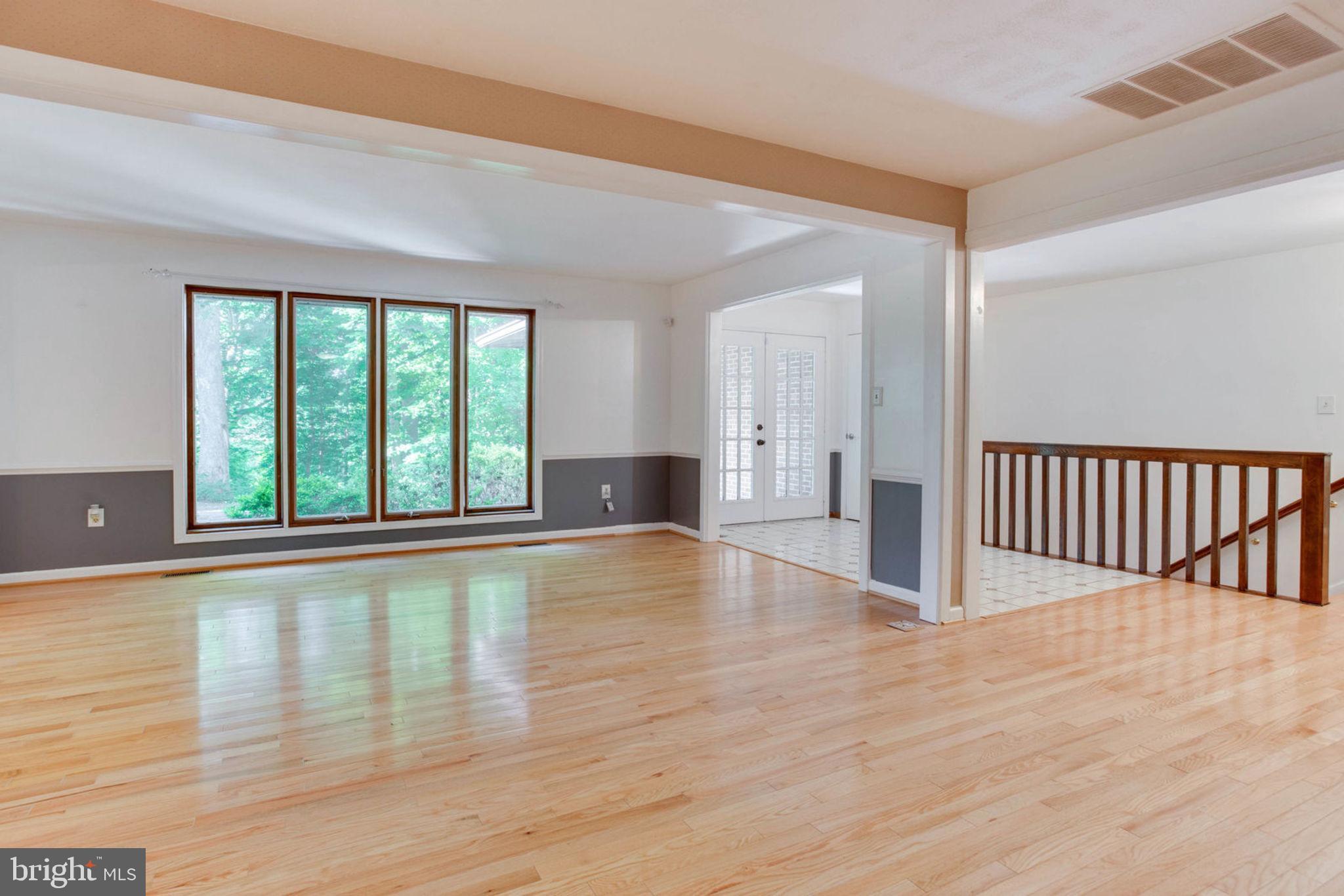 4304 Rousbys Run West River, MD 20778 - Photo 6 of 50 a view of an empty room with wooden floor and a window