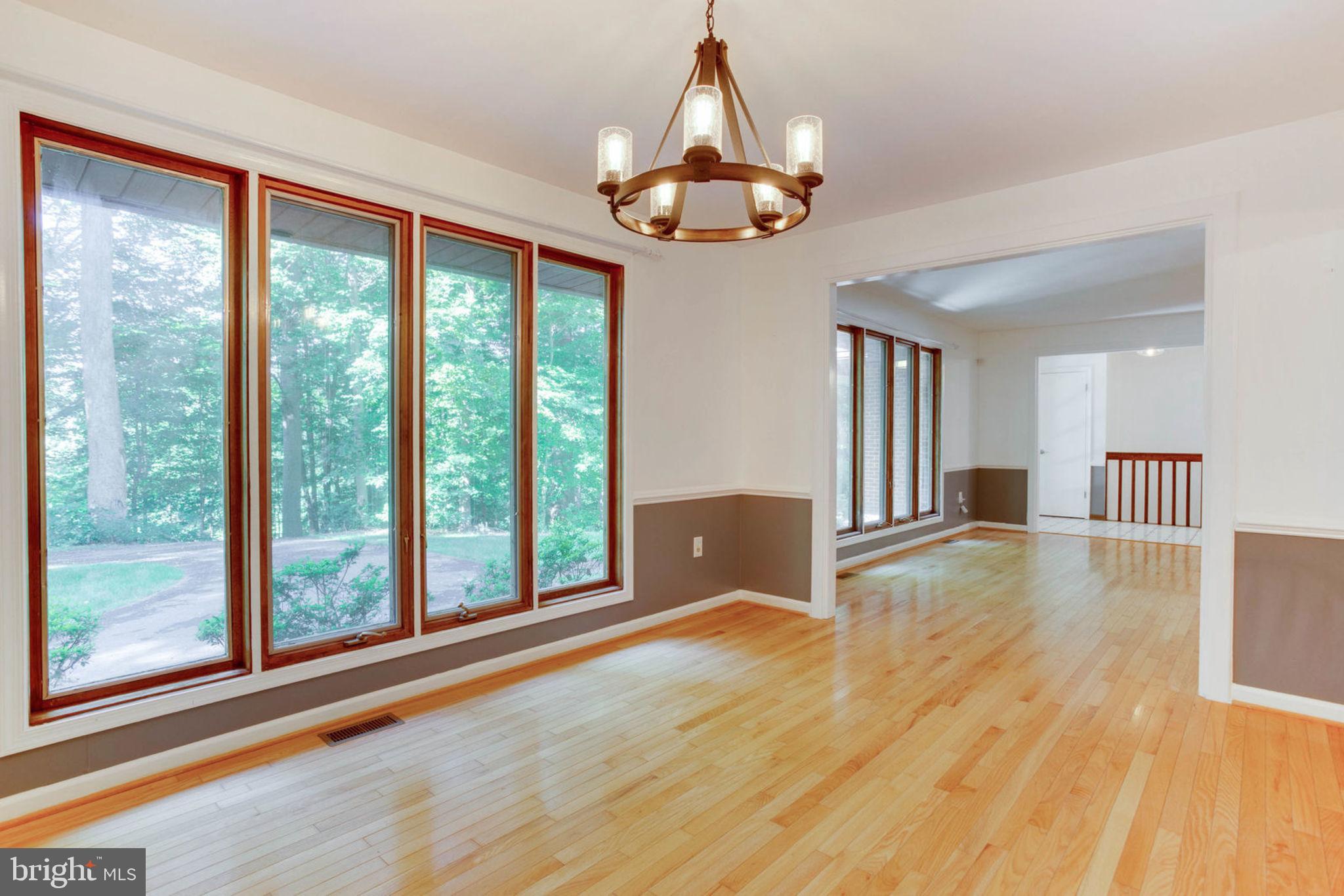 4304 Rousbys Run West River, MD 20778 - Photo 7 of 50 a view of an empty room with wooden floor and a window