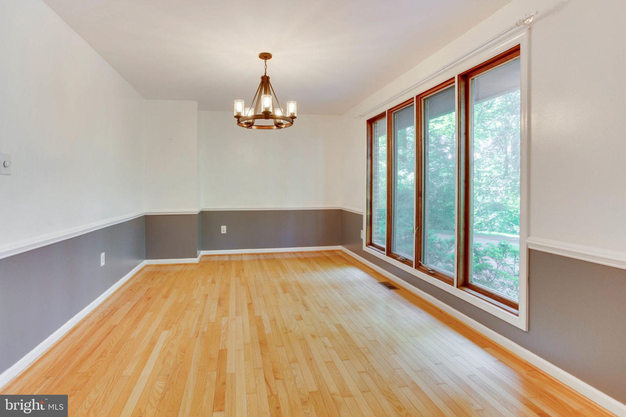 4304 Rousbys Run West River, MD 20778 - Photo 8 of 50 a view of empty room with wooden floor and fan