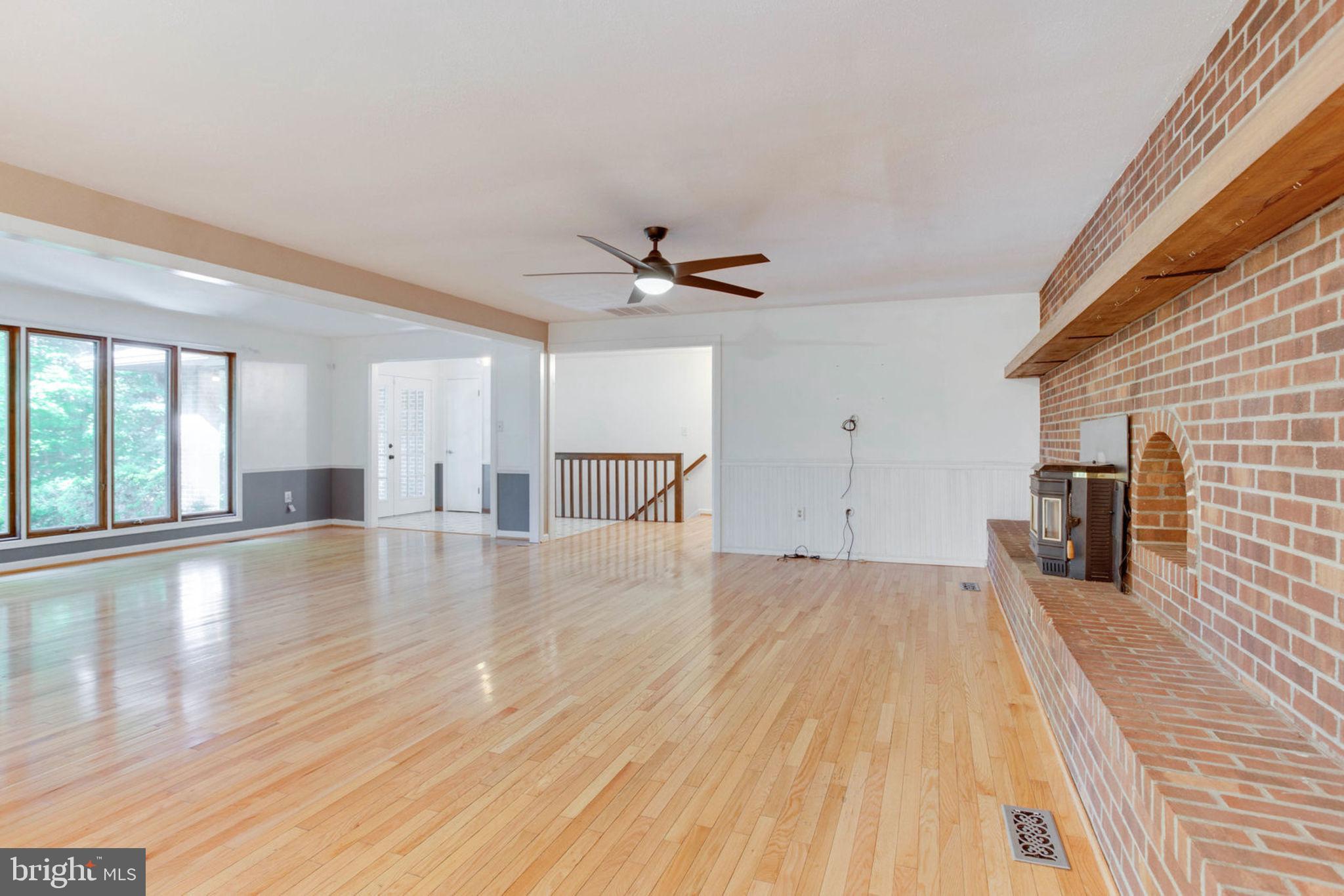 4304 Rousbys Run West River, MD 20778 - Photo 9 of 50 a view of a livingroom with a ceiling fan and wooden floor