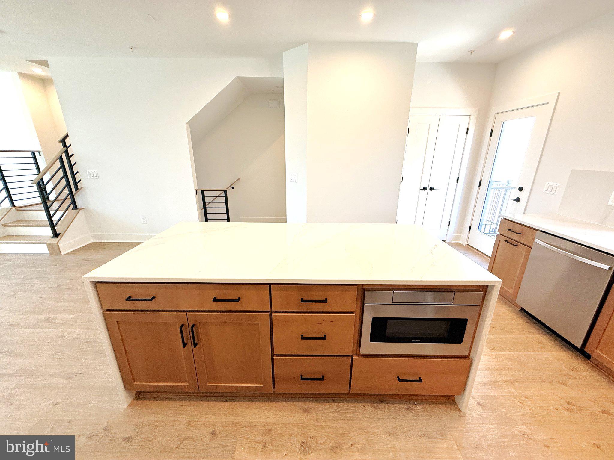 33 Lower Service Court Northwest Washington, DC 20001 - Photo 22 of 51 Modern kitchen with sleek island design.