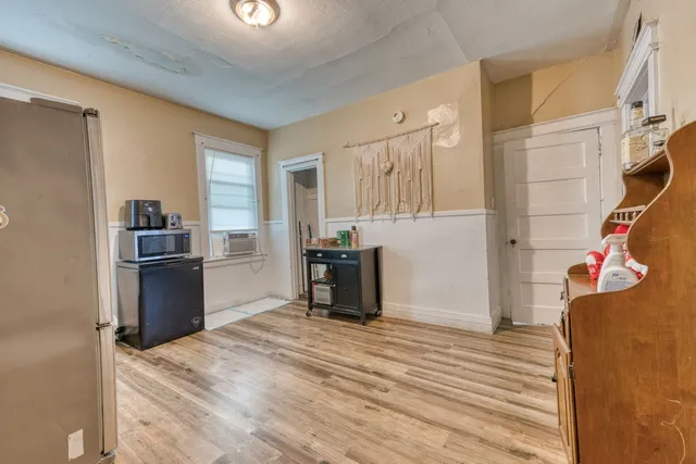 a kitchen with a refrigerator and a stove
