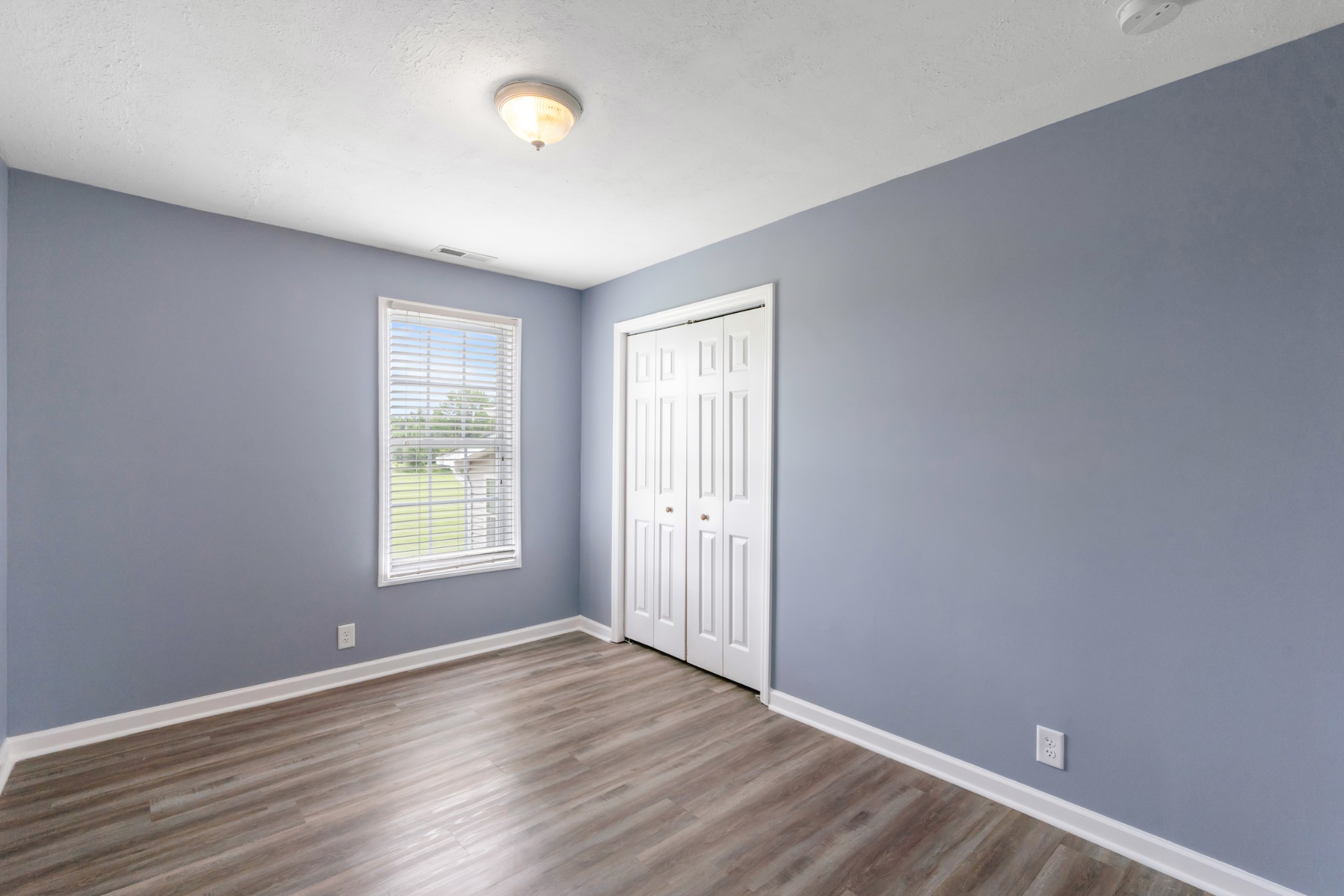 4602 Washington Road Springfield, TN 37172 - Photo 27 of 63 an empty room with wooden floor and windows