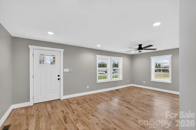 a view of an empty room with a window