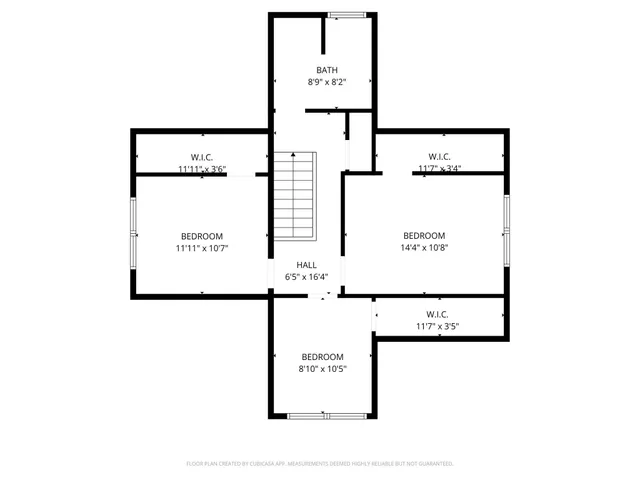 a picture of a bench in front of a wall