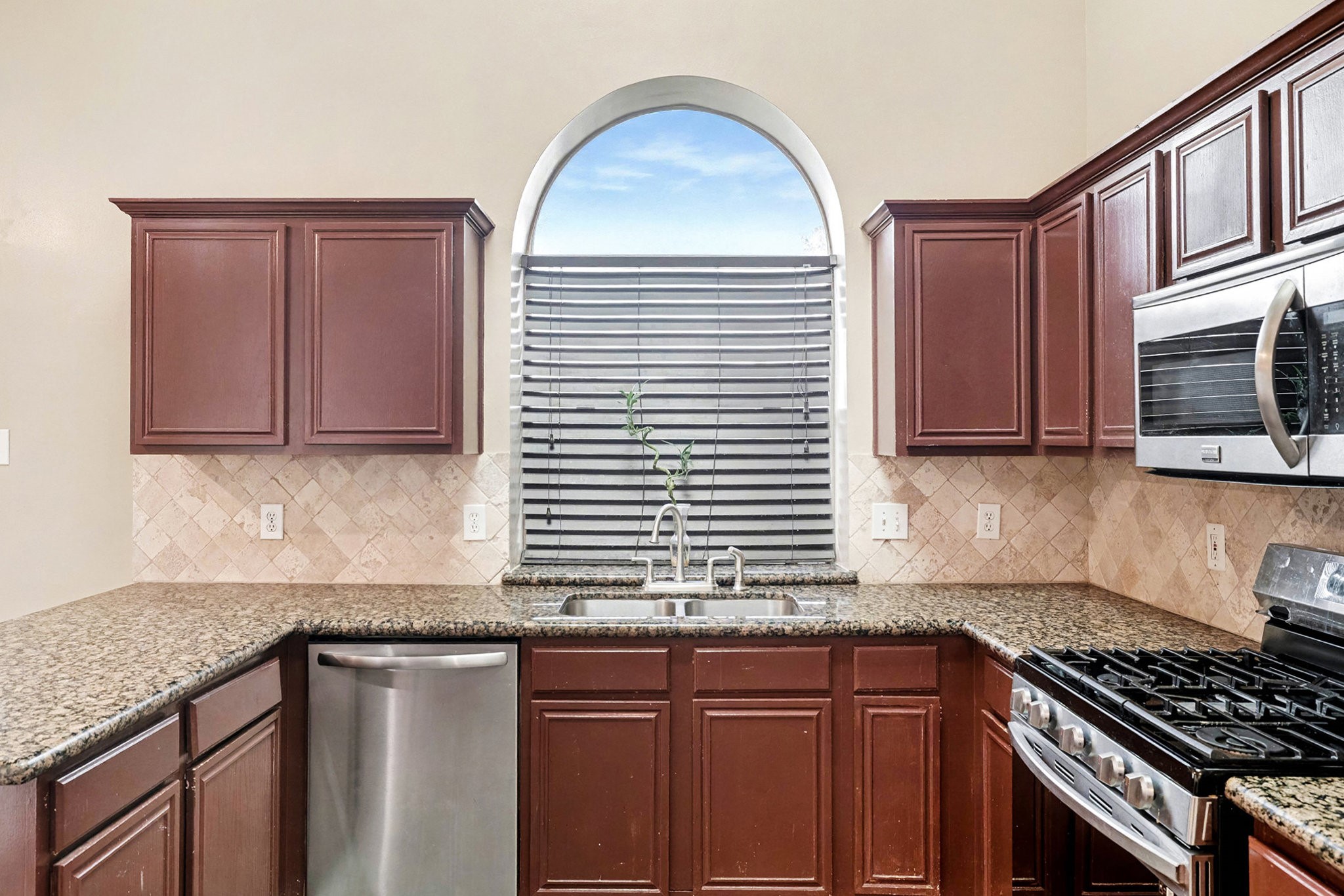 12411 Wright Oaks Drive Houston, TX 77014 - Photo 15 of 29 a kitchen with stainless steel appliances granite countertop a sink stove and cabinets