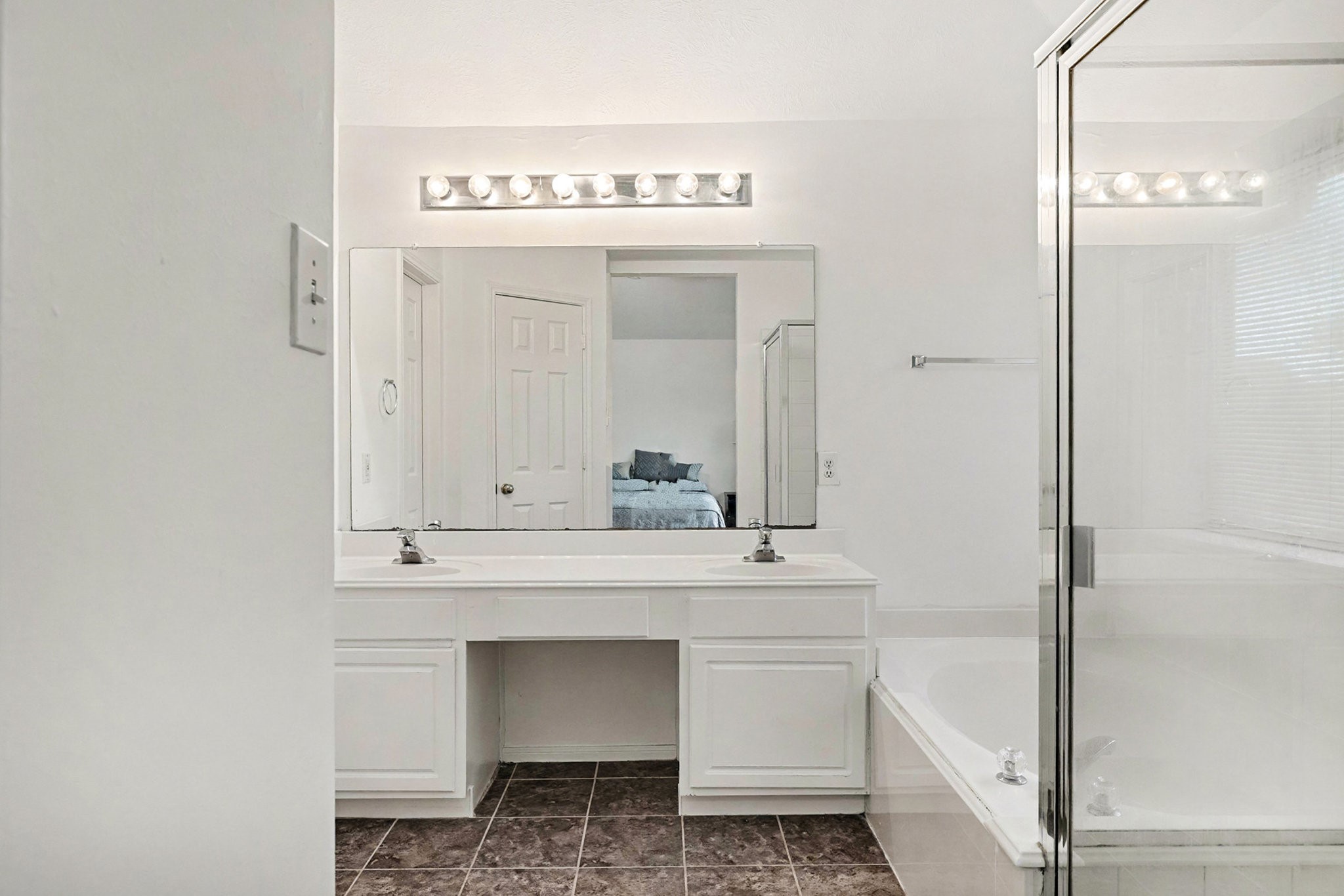 12411 Wright Oaks Drive Houston, TX 77014 - Photo 23 of 29 a bathroom with a sink a mirror and a bathtub