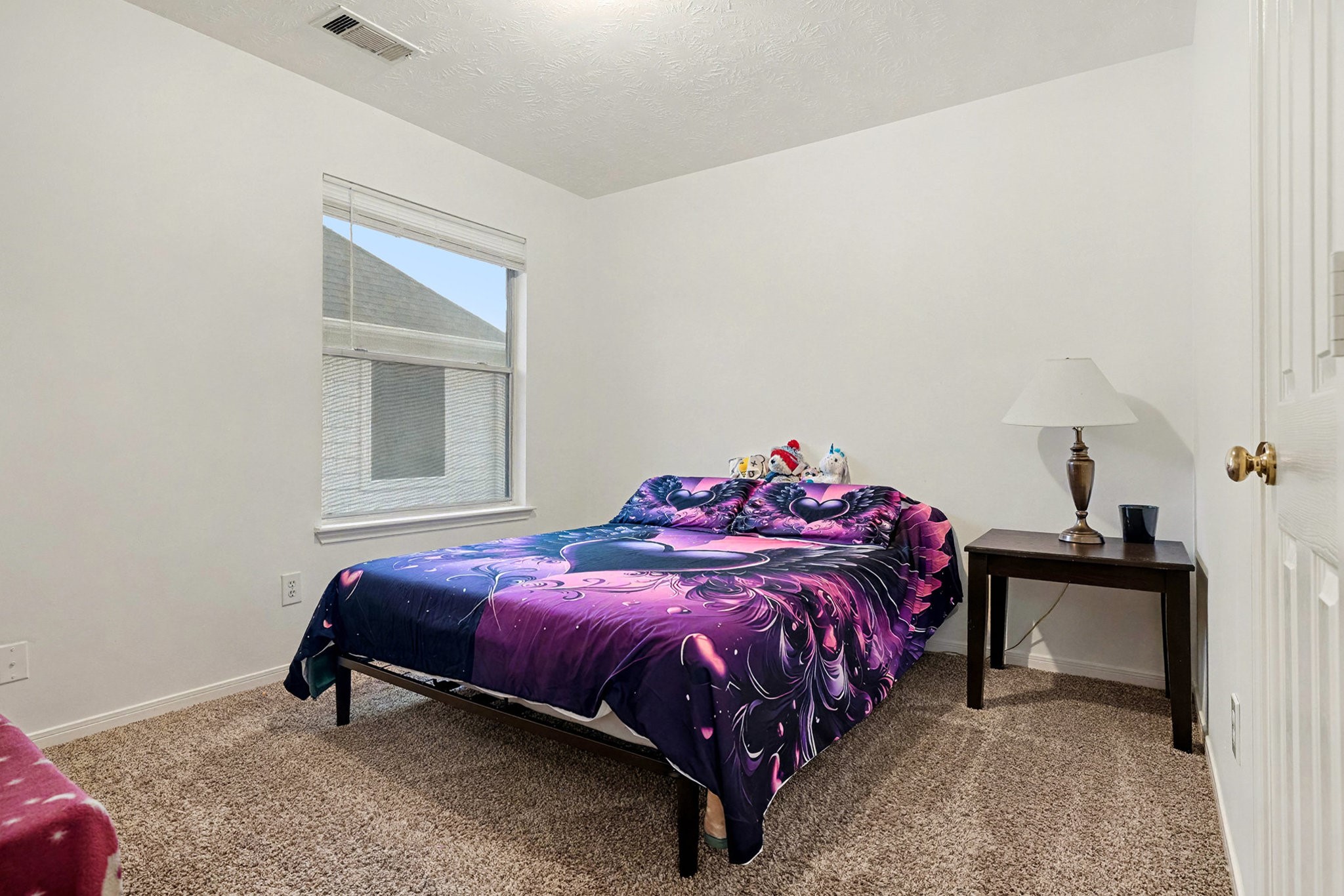 12411 Wright Oaks Drive Houston, TX 77014 - Photo 25 of 29 a bedroom with a bed and a window