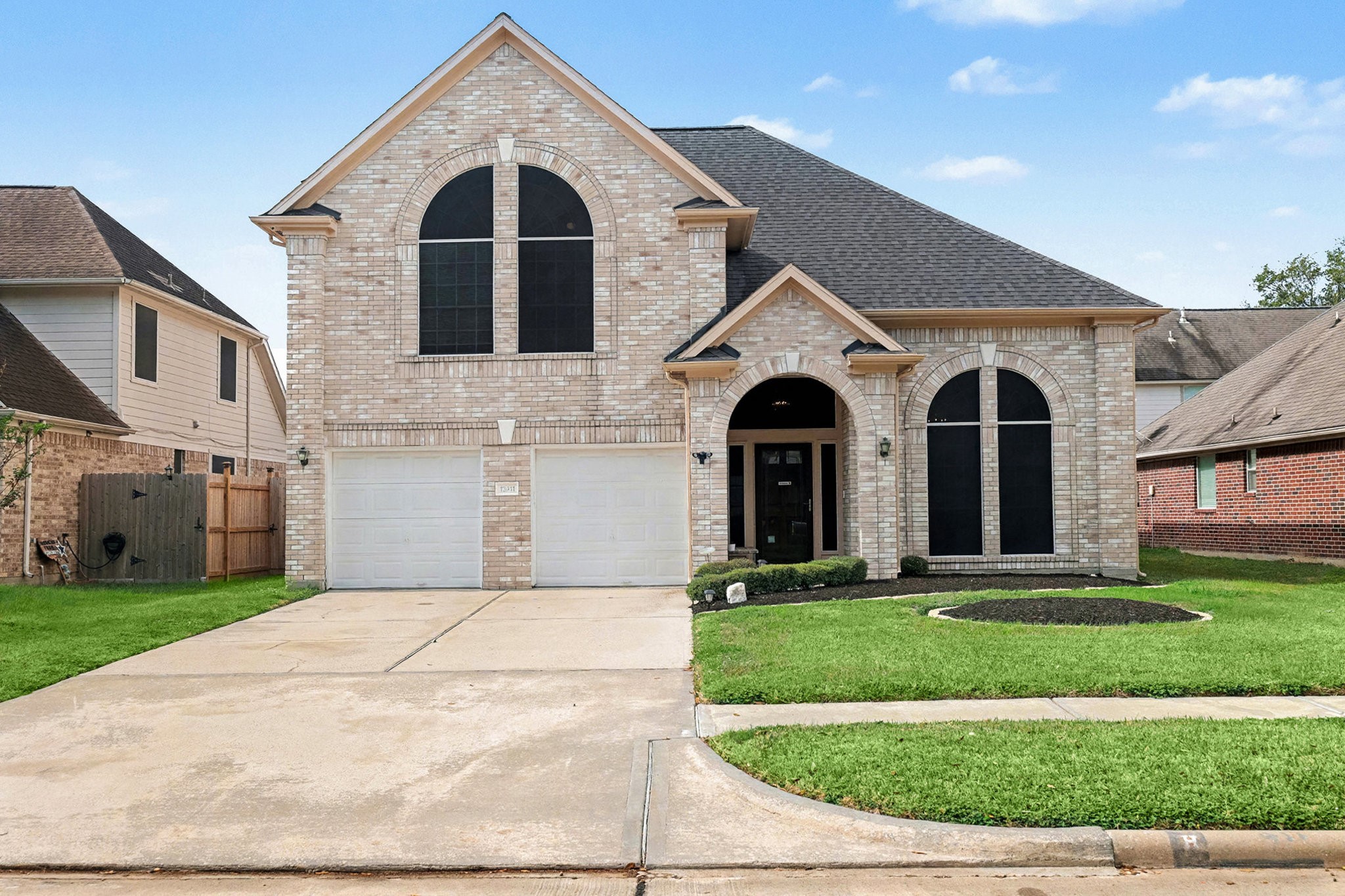 12411 Wright Oaks Drive Houston, TX 77014 - Photo 4 of 29 a front view of a house with yard and garage