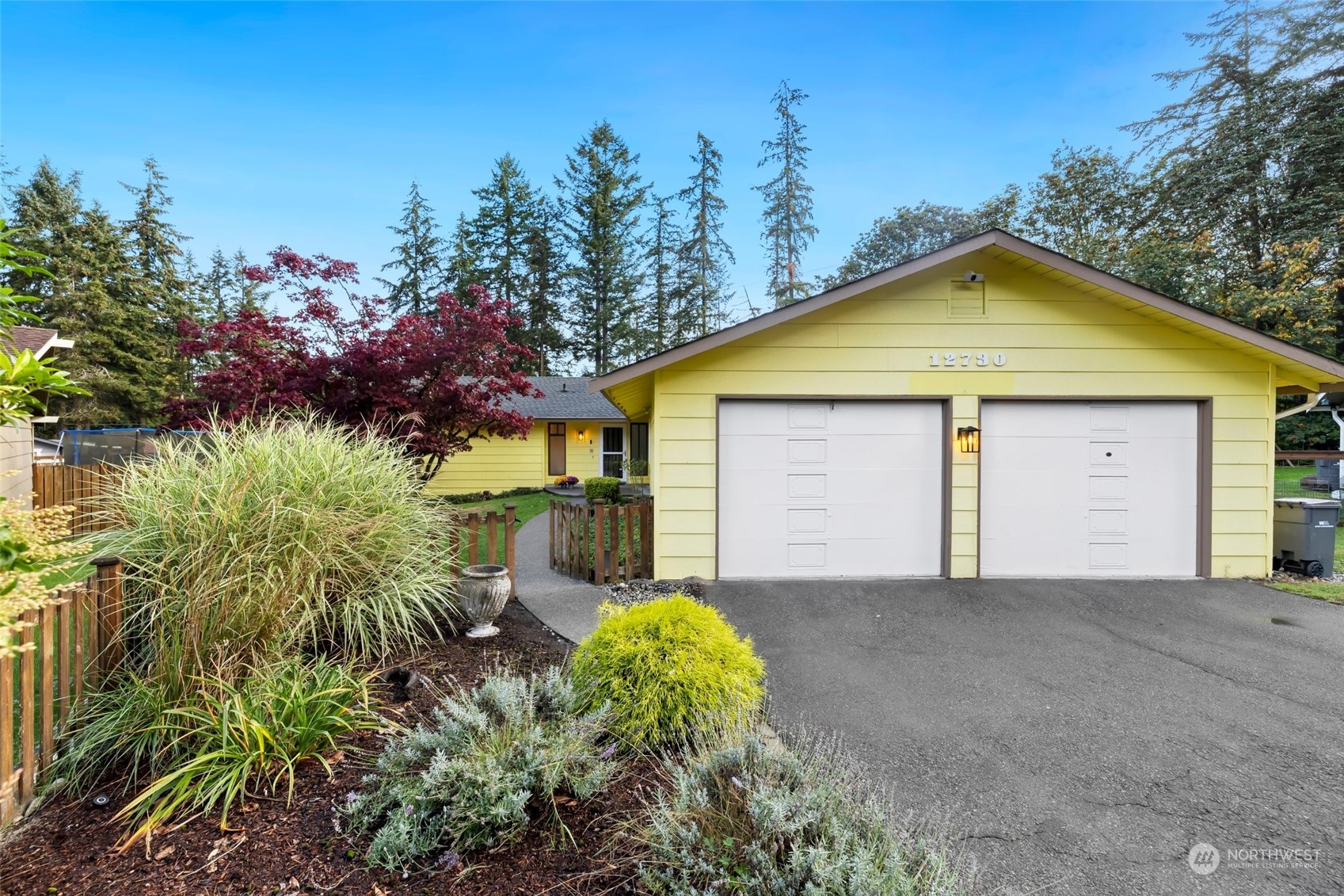 12730 Southeast 95th Place Renton, WA 98056 - Photo 1 of 38 a view of a house with a yard and large tree