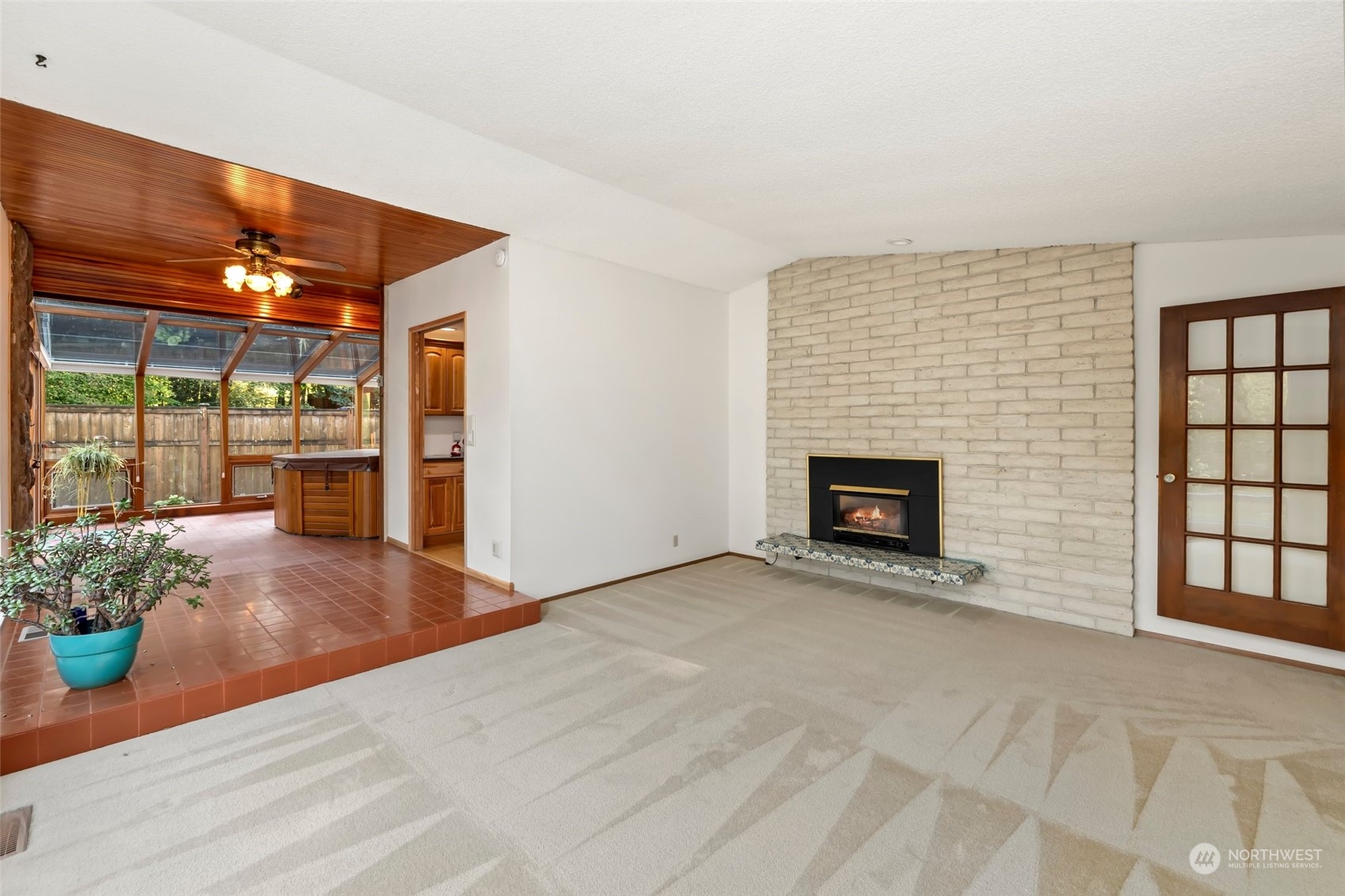 12730 Southeast 95th Place Renton, WA 98056 - Photo 12 of 38 an empty room with windows and fireplace