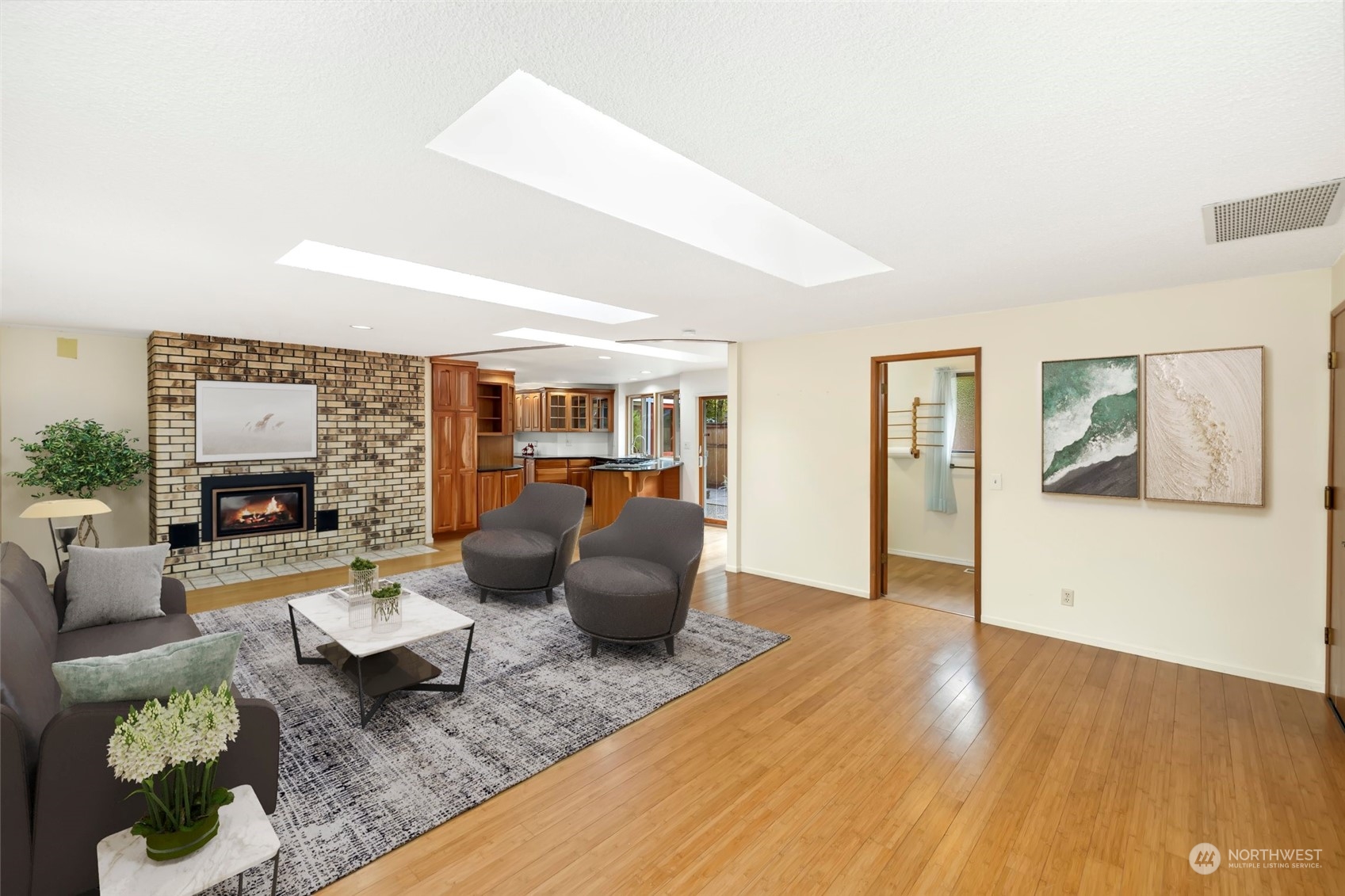 12730 Southeast 95th Place Renton, WA 98056 - Photo 2 of 38 a living room with furniture wooden floor and a fireplace