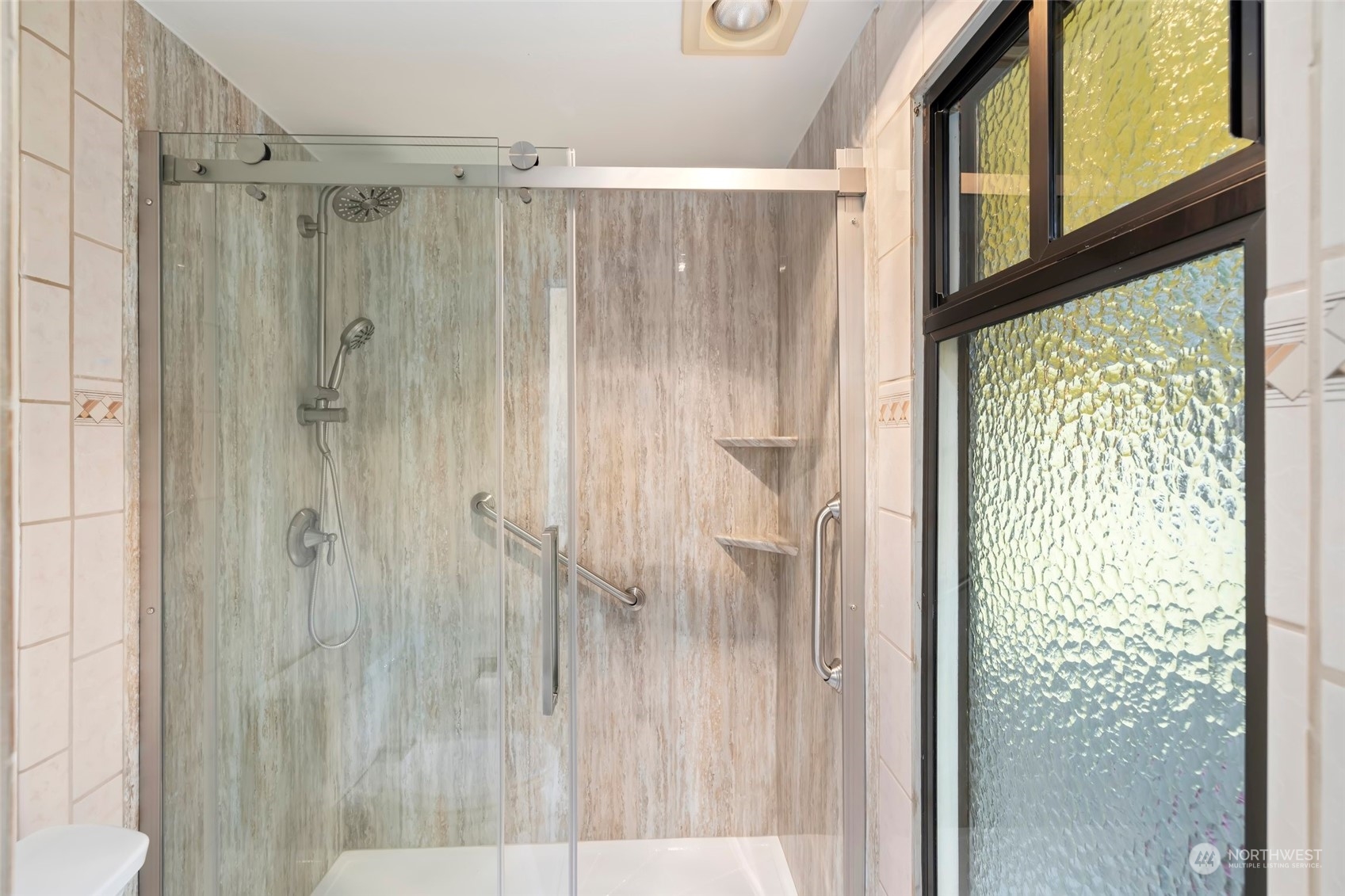 12730 Southeast 95th Place Renton, WA 98056 - Photo 22 of 38 a bathroom with a shower and a window