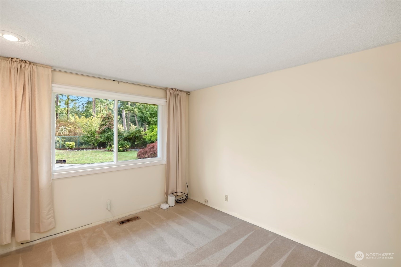 12730 Southeast 95th Place Renton, WA 98056 - Photo 24 of 38 an empty room with wooden floor and windows