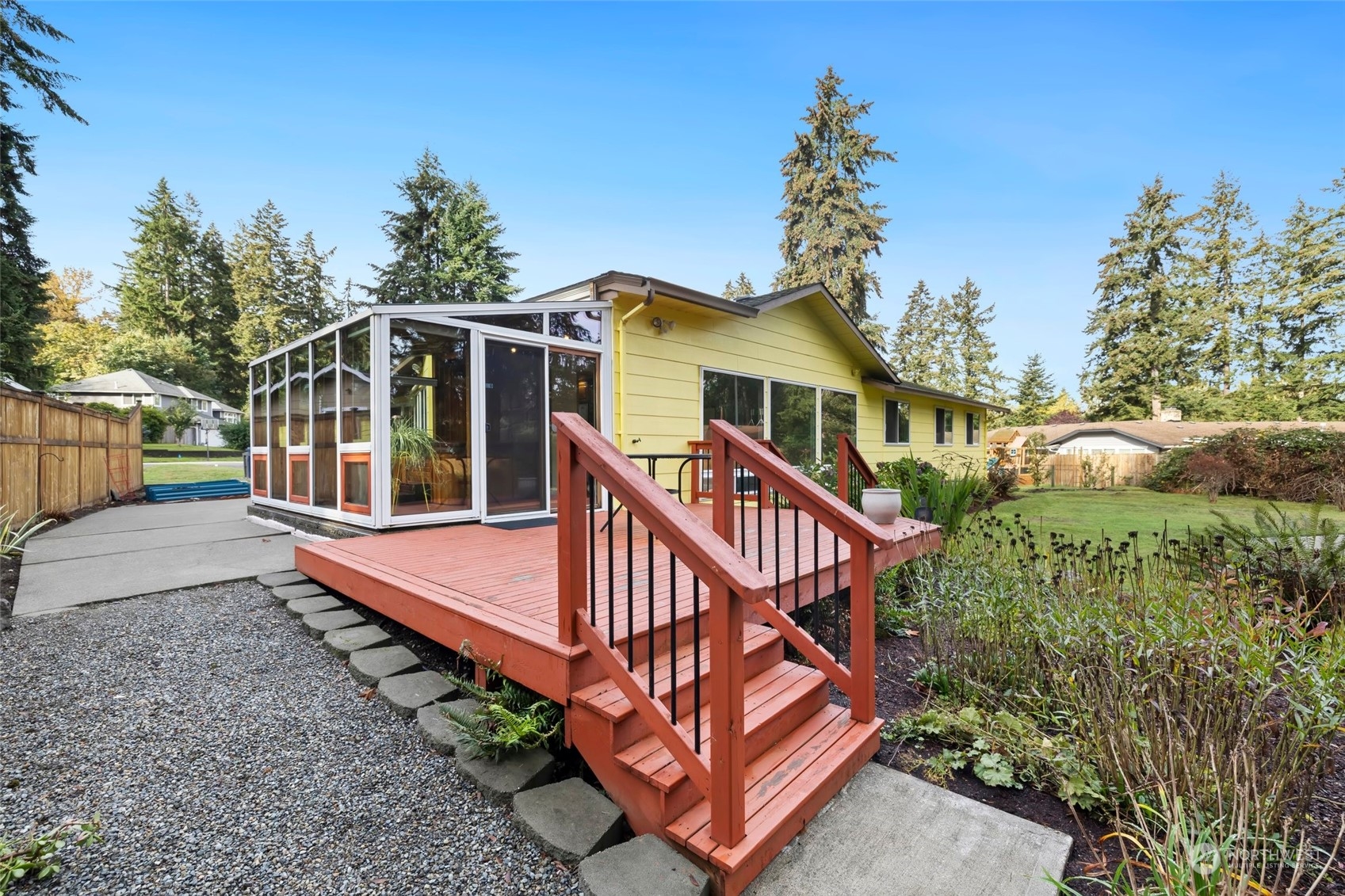 12730 Southeast 95th Place Renton, WA 98056 - Photo 31 of 38 a view of a house with large trees and wooden fence