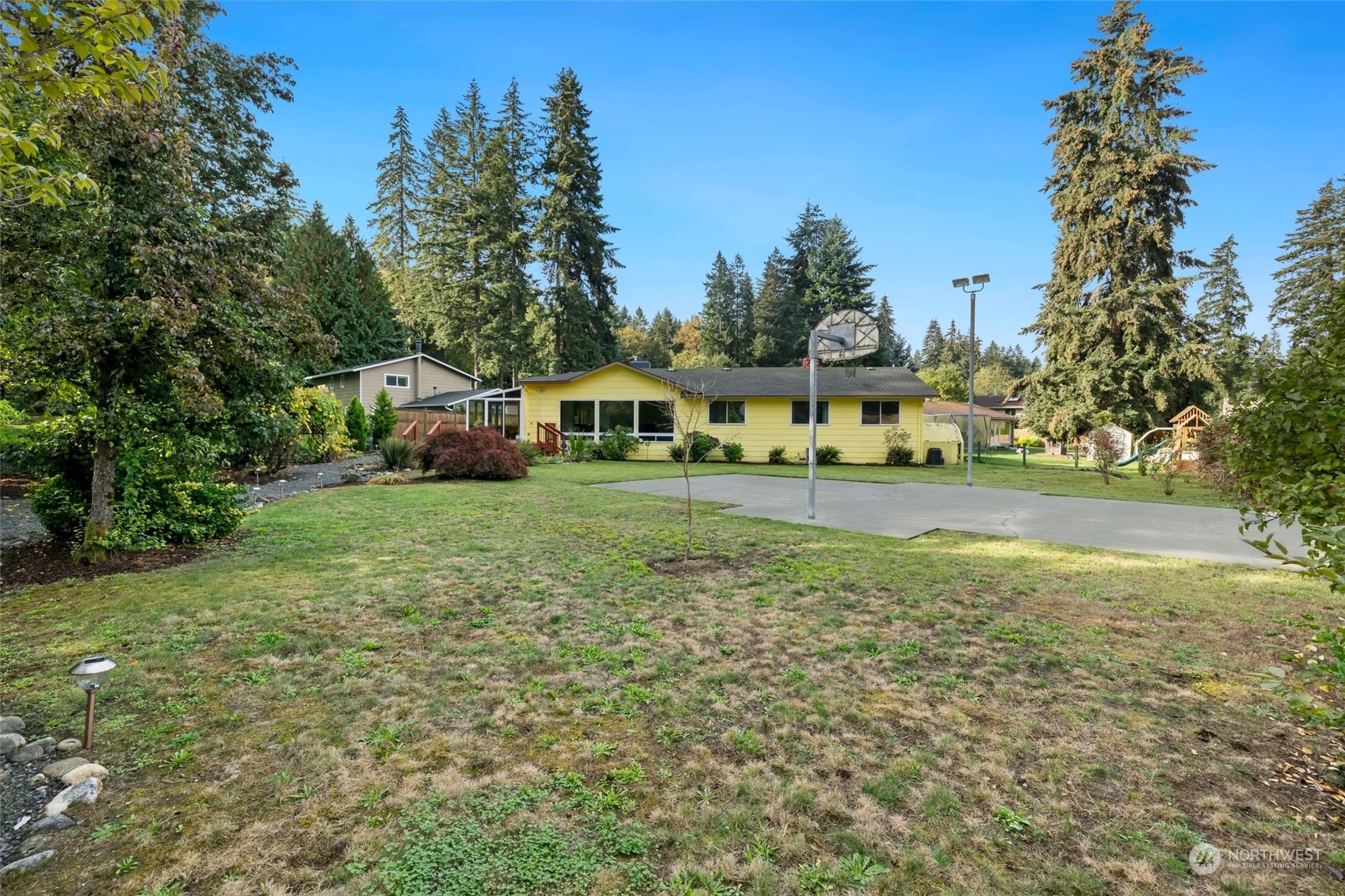 12730 Southeast 95th Place Renton, WA 98056 - Photo 35 of 38 a view of a house with a yard and sitting area