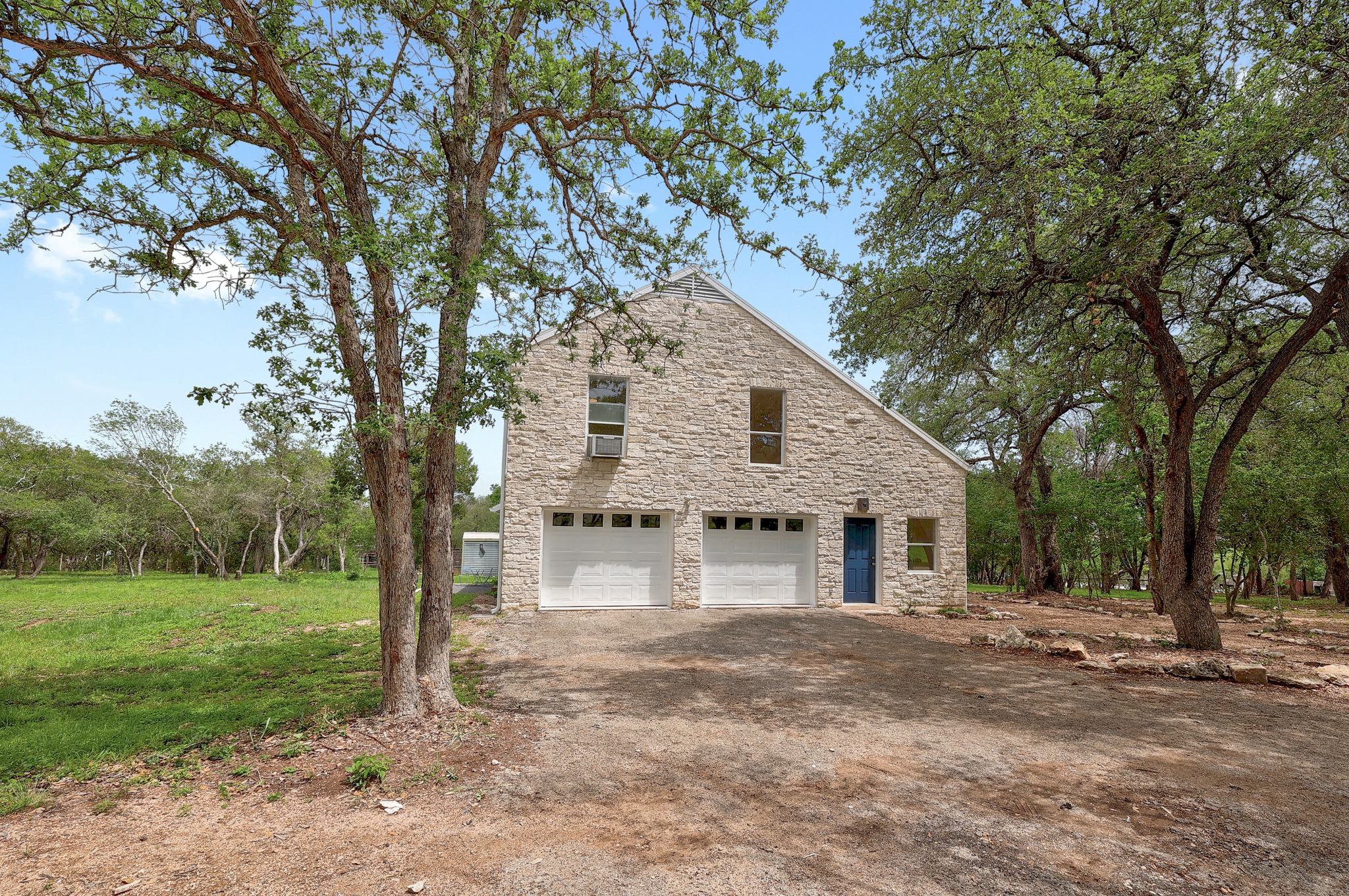 1700 Patterson Road Austin, TX 78733 - Photo 27 of 36 Side of the house with large 2 car garage