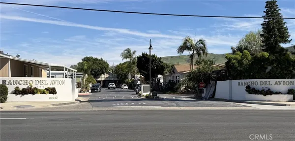 a view of a house with a street