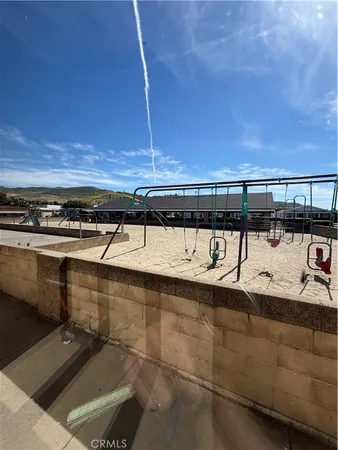 a view of a swimming pool and an outdoor space