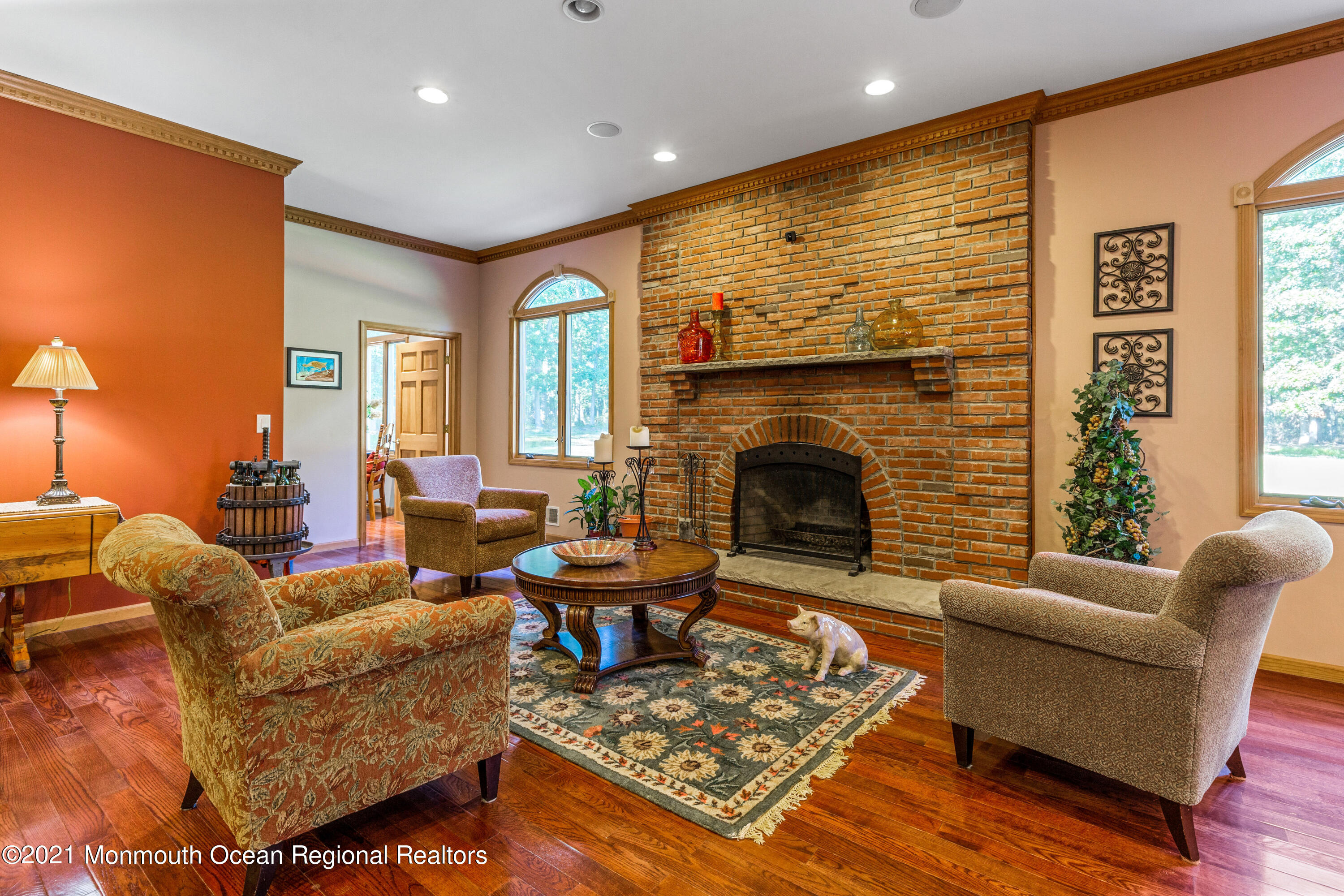 363 Lanes Pond Road Howell, NJ 07731 - Photo 22 of 72 a living room with furniture fireplace and a table