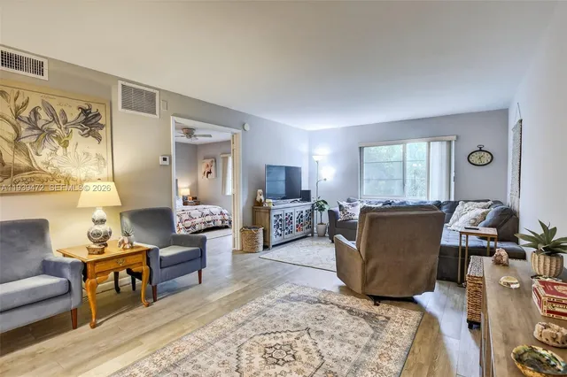a living room with furniture and a window