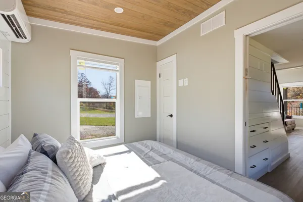 a bed room with a bed and a window