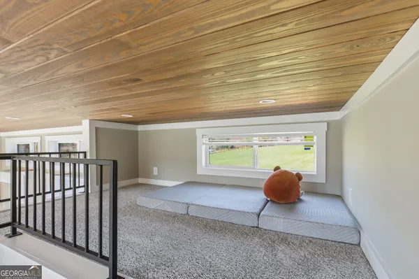 a view of an empty room and window