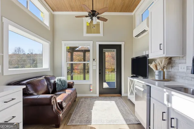 a living room with furniture and a flat screen tv