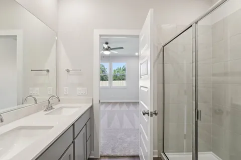 a view of a house with backyard and a tree