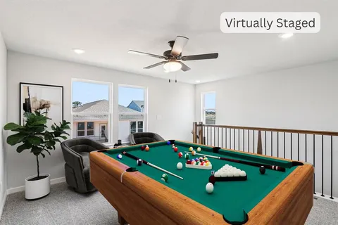 a kitchen with white cabinets a sink and stainless steel appliances