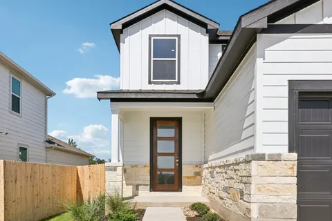 a front view of a house with a white door