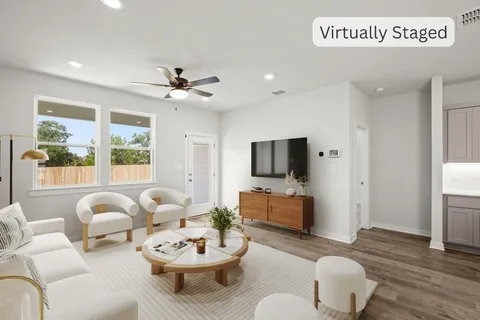 a kitchen with stainless steel appliances a microwave sink refrigerator and cabinets