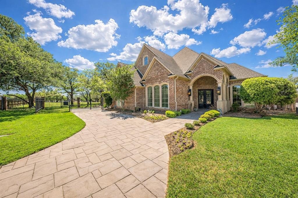 a front view of house with yard and green space