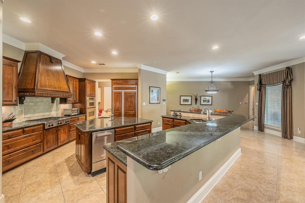 2726 Country Club Road Pantego, TX 76013 - Photo 11 of 26 a kitchen with stainless steel appliances granite countertop a sink stove and refrigerator