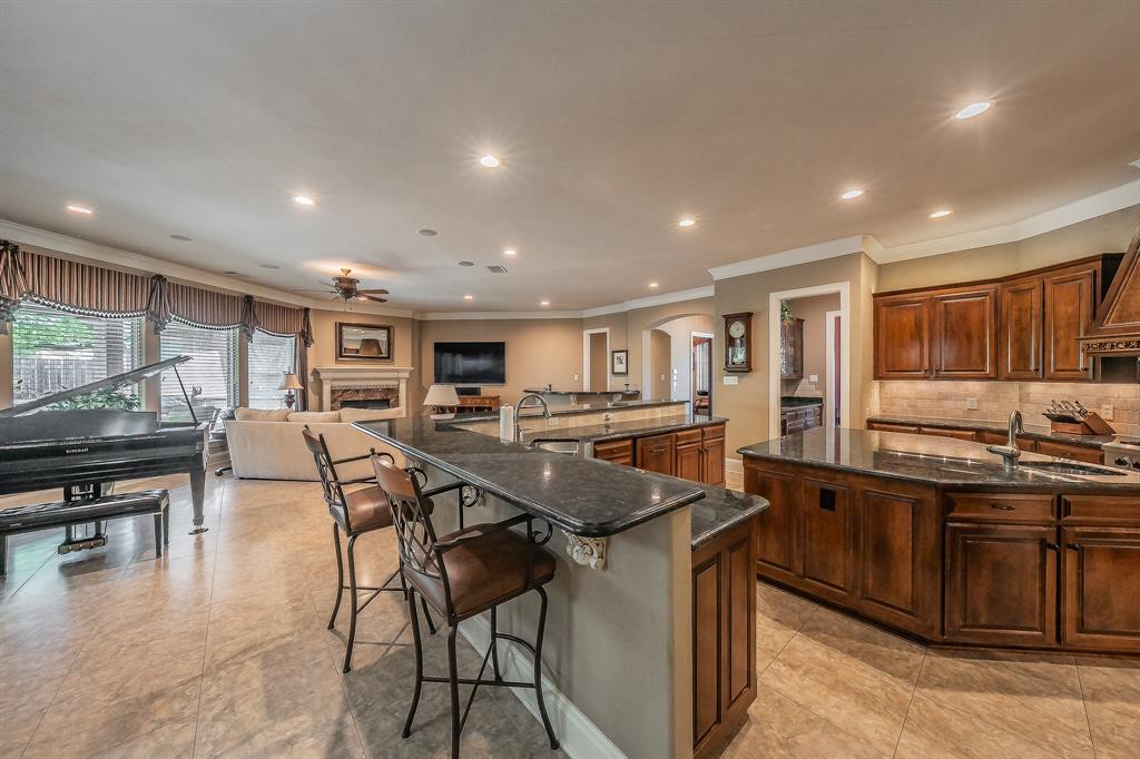 2726 Country Club Road Pantego, TX 76013 - Photo 12 of 26 a dining hall with stainless steel appliances granite countertop a stove and a view of living room