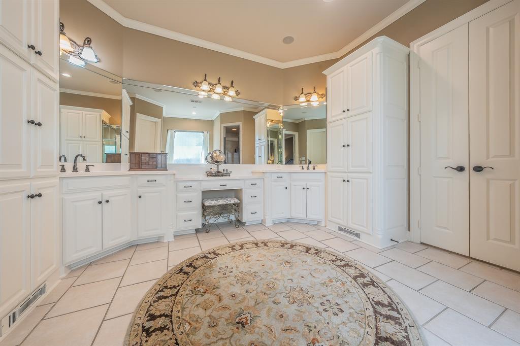 2726 Country Club Road Pantego, TX 76013 - Photo 17 of 26 a spacious bathroom with a sink mirror and shower