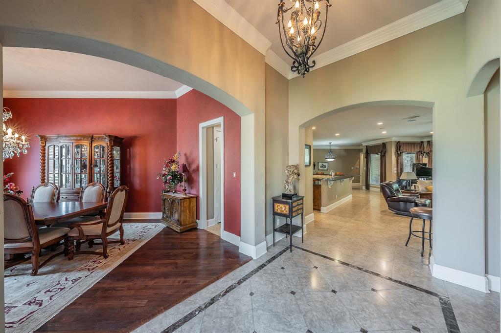 2726 Country Club Road Pantego, TX 76013 - Photo 2 of 26 a living room with furniture a dining table and chairs with wooden floor