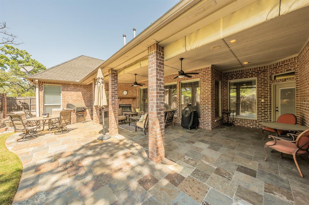 2726 Country Club Road Pantego, TX 76013 - Photo 22 of 26 a view of a chairs with a patio