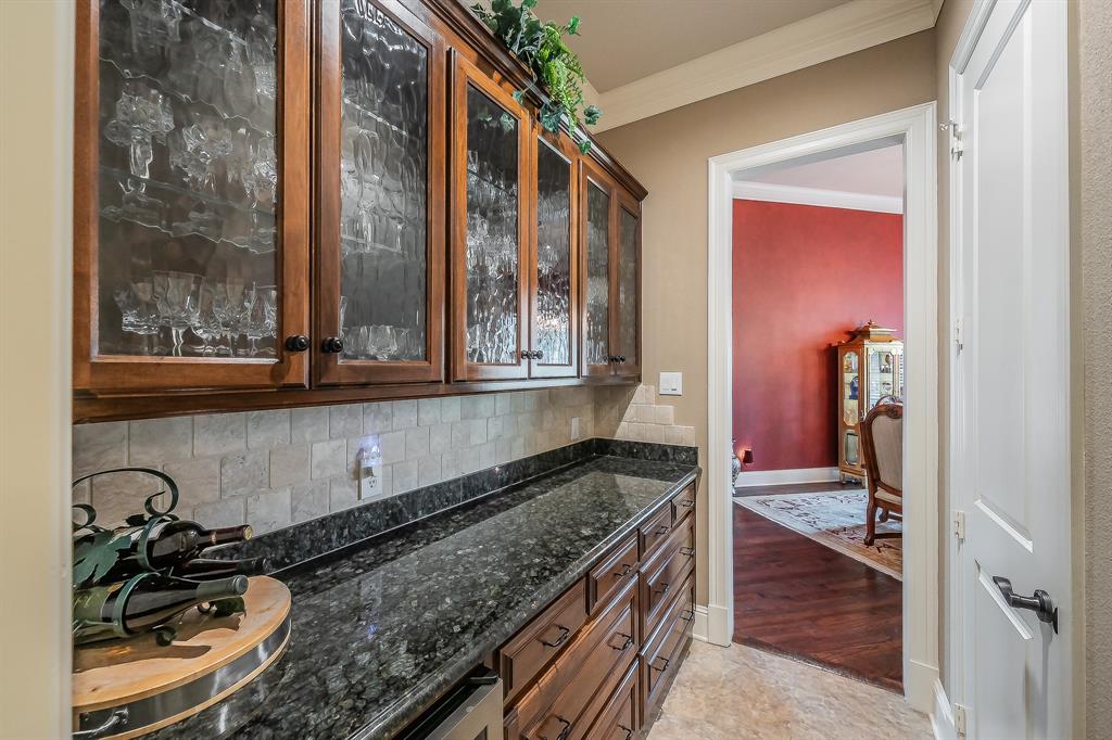 2726 Country Club Road Pantego, TX 76013 - Photo 4 of 26 a kitchen with a granite countertop sink and a stove top oven