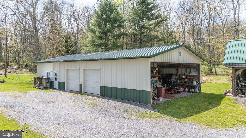 2270 Pine Tree Road Hughesville, PA 17737 - Photo 17 of 90 Spacious garage nestled in nature.
