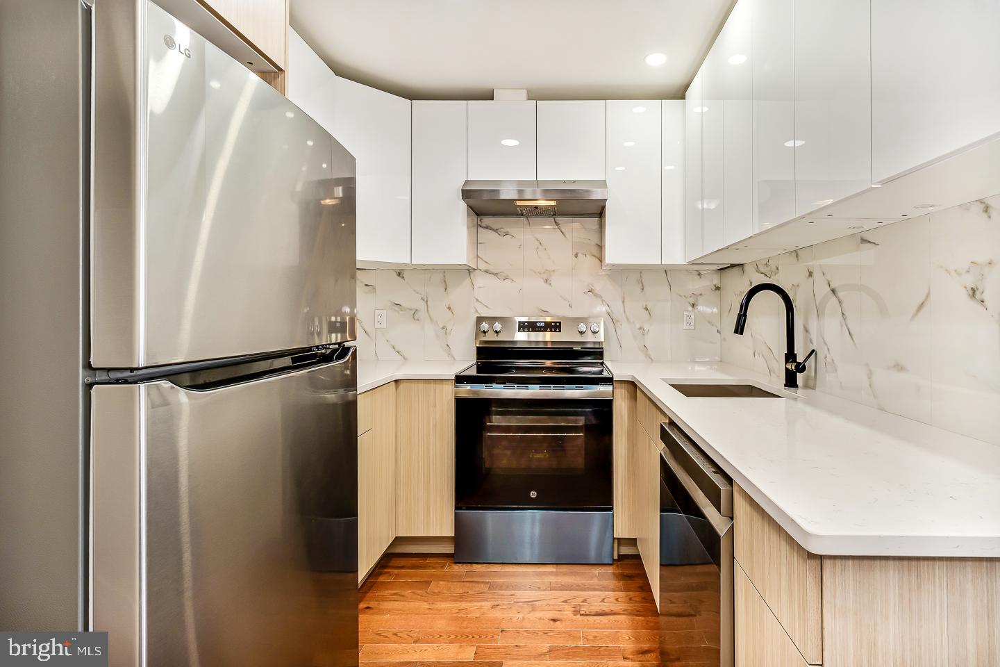 182 East Huntingdon Street Philadelphia, PA 19125 - Photo 18 of 41 a kitchen with a sink appliances and cabinets