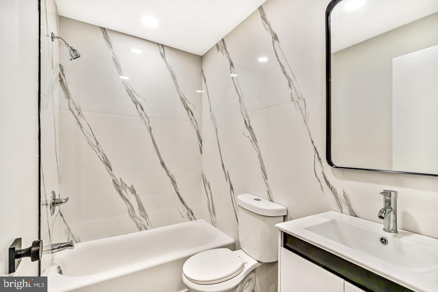 182 East Huntingdon Street Philadelphia, PA 19125 - Photo 20 of 41 a bathroom with a sink a toilet and shower