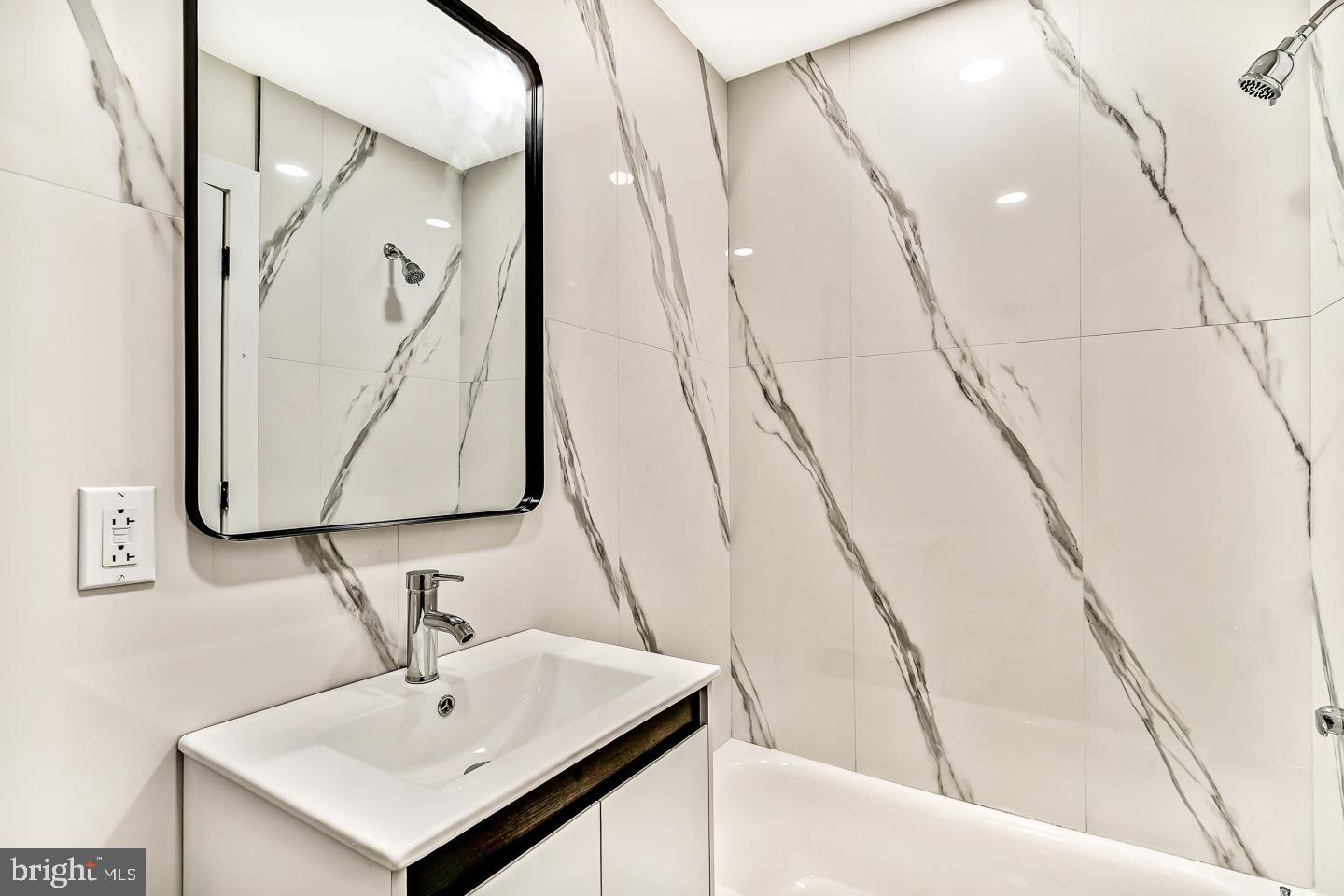 182 East Huntingdon Street Philadelphia, PA 19125 - Photo 27 of 41 a bathroom with a sink a mirror and vanity