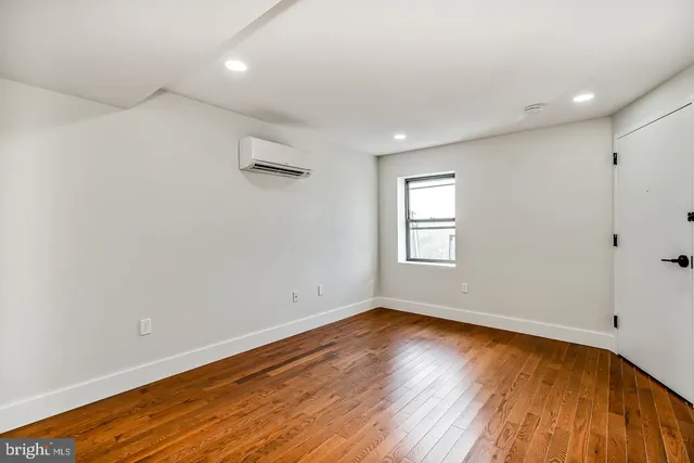 a kitchen with stainless steel appliances a refrigerator and a stove top oven